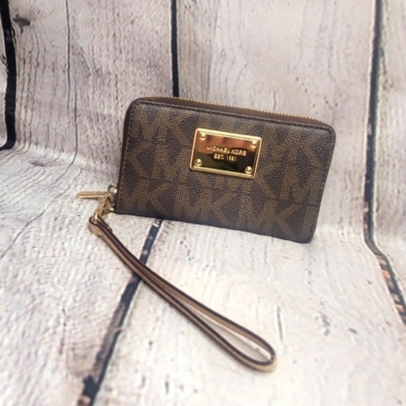 Michael Kors Handbags - Michael Kors Jet Set Monogram Brown Wristlet